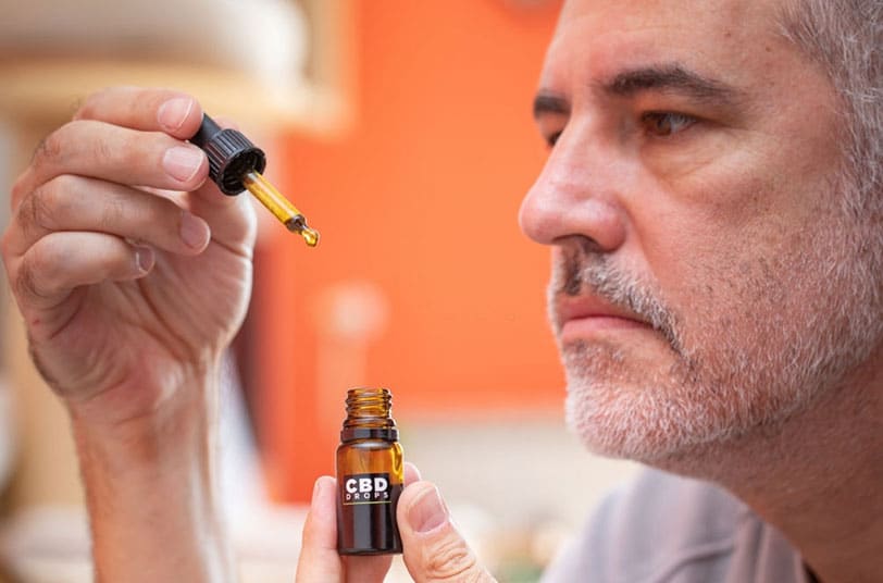 man checking how to use cbd oil