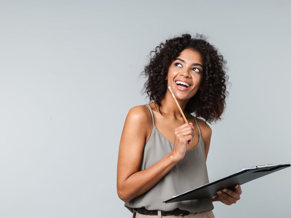 woman taking notes on baking with cbd oil