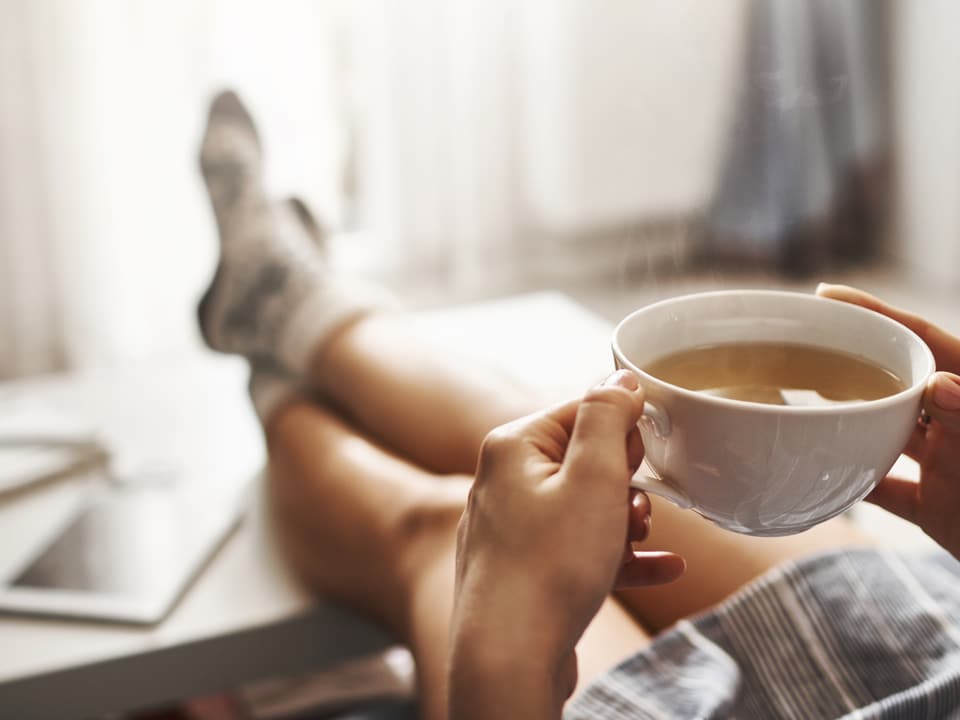 man relaxing while taking a cbd infused tea