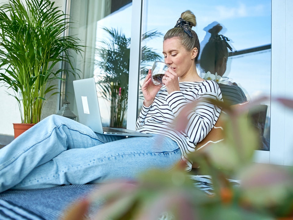 woman feeling relaxed while drinking cbd coffee