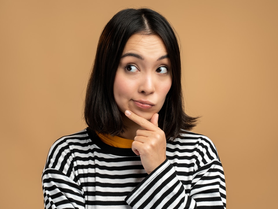 woman thinking the difference between thc and cbdwoman thinking the difference between thc and cbd