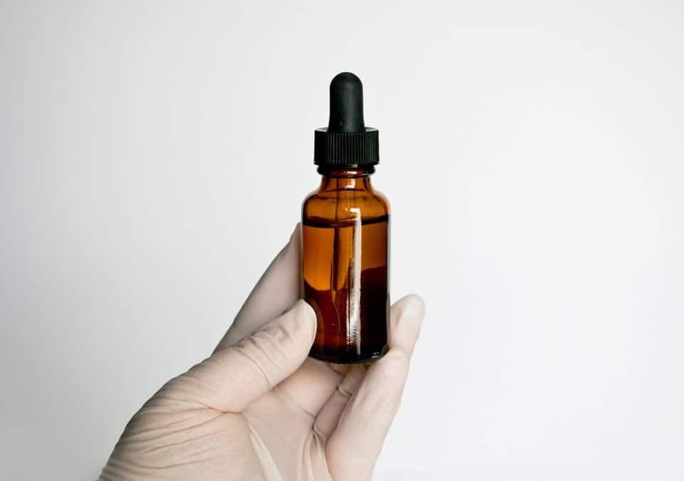 researcher checking cbd oil quality