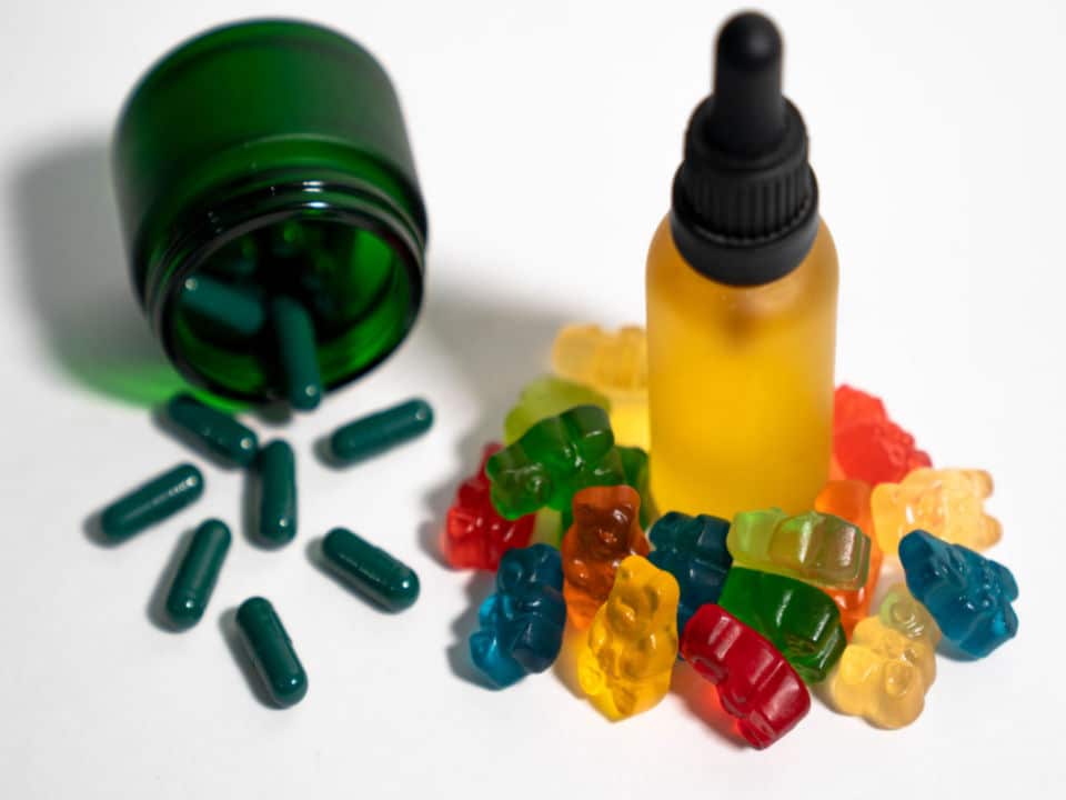 cbd gummies cbd oil and cbd capsules in jar