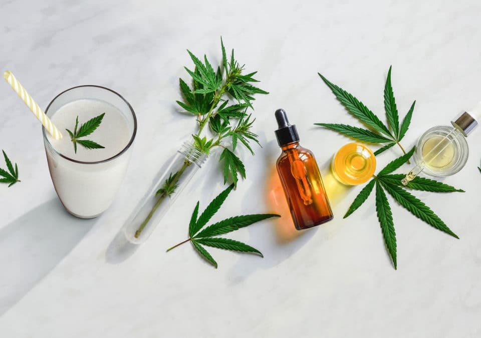 bottles of cbd oil put in fresh beverage