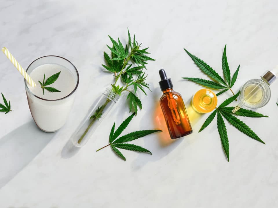 bottles of cbd oil put in fresh beverage