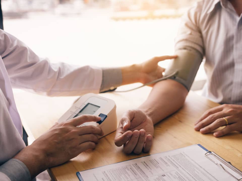 man consulting doctor if cbd is safe for high cholesterol